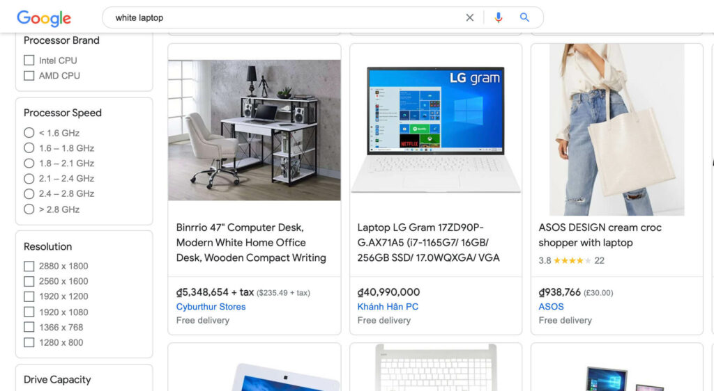 Google Shopping search results for white laptop